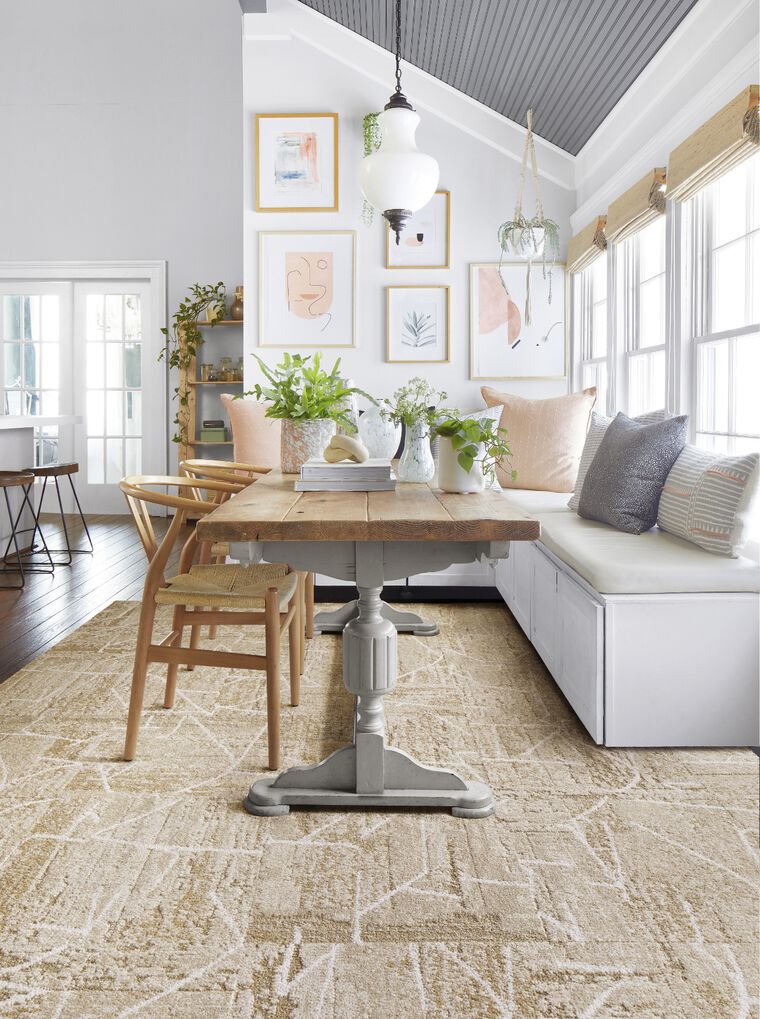 Breakfast nook with FLOR area rug Terrain shown in Pearl